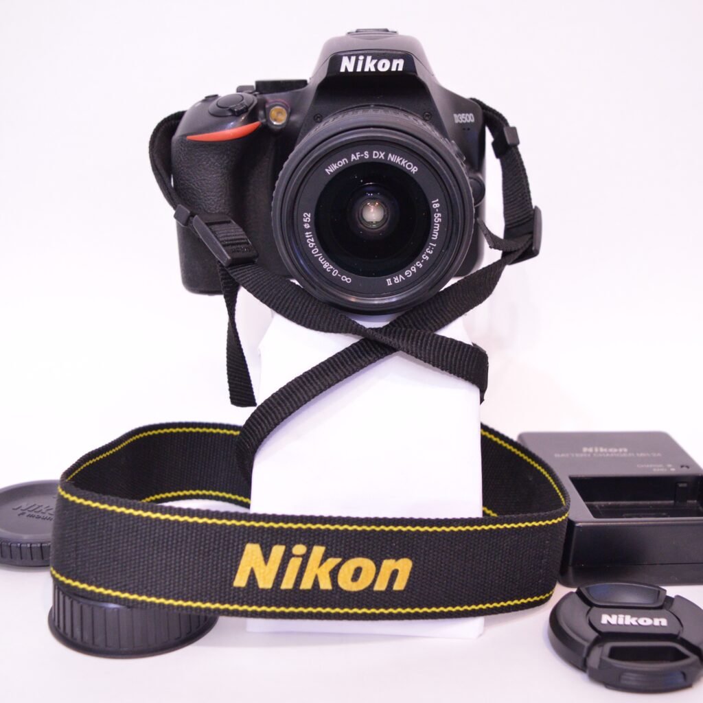 Nikon D3500 Camera with accessories on white background