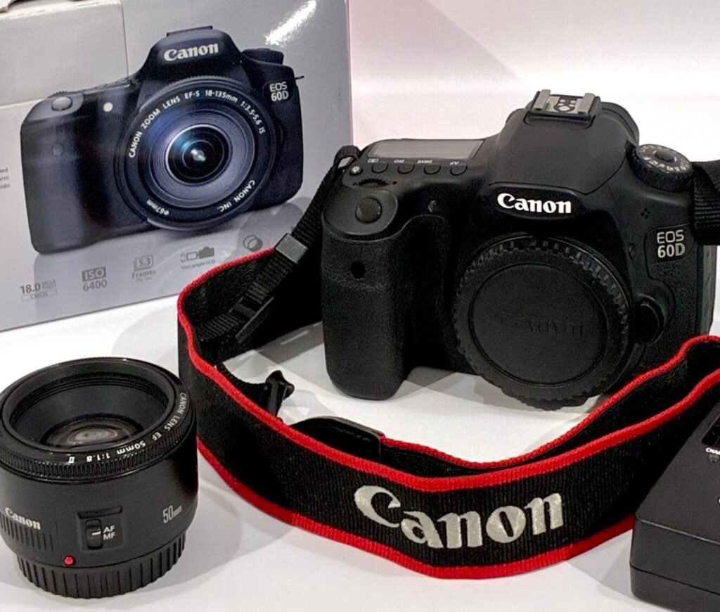 Used Canon EOS 60D camera with Canon EF 50mm f/1.8 STM lens, strap, charger, and battery